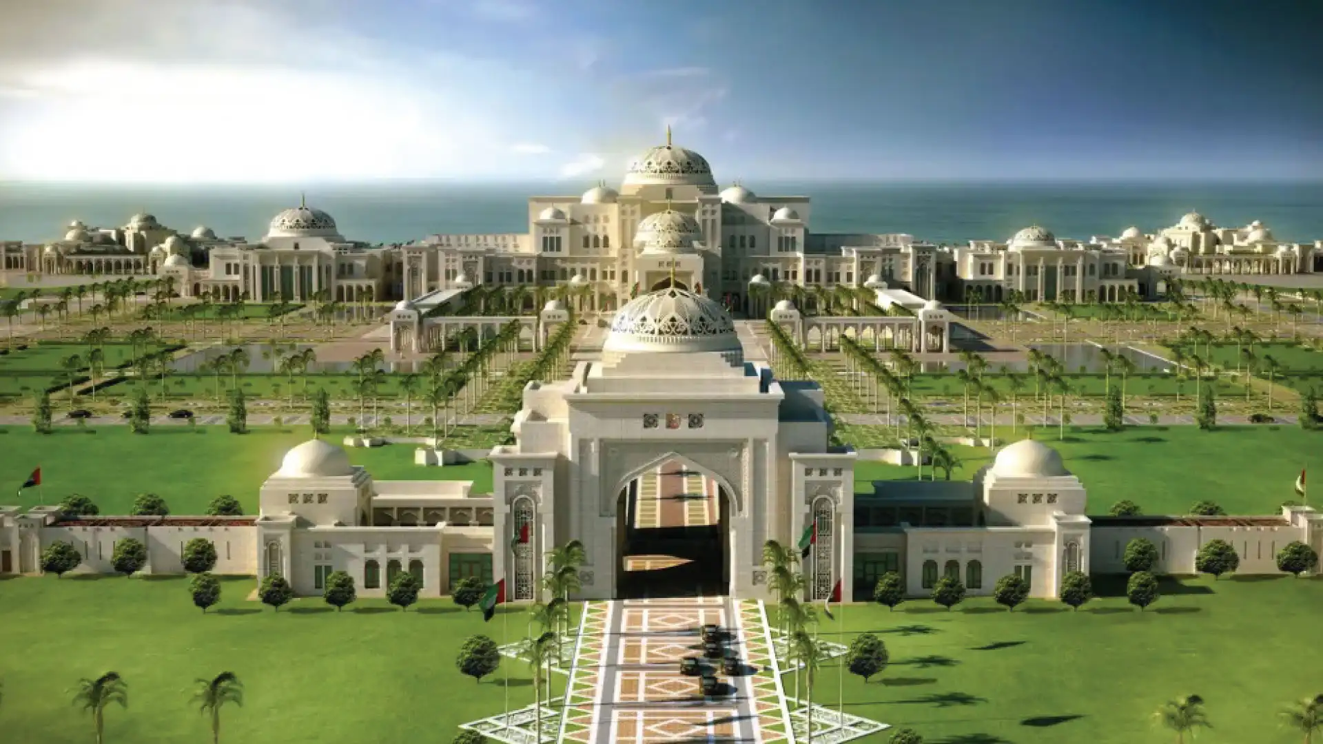 Aerial view of Qasr Al Watan Presidential Palace in Abu Dhabi showing its white domed architecture, central archway, and manicured gardens